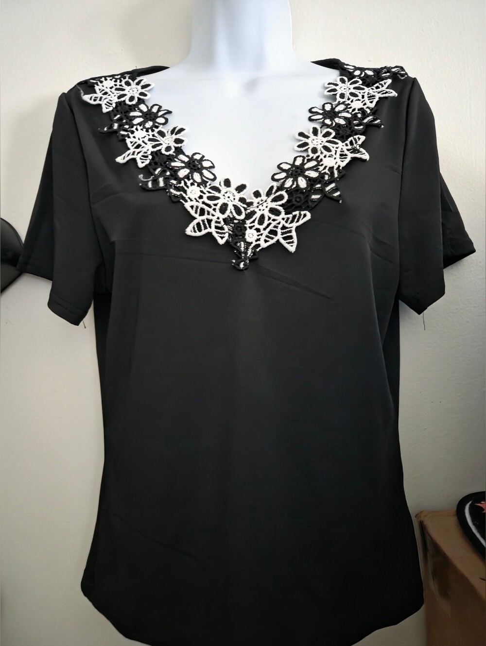 Black Women's V-Neck Top with White Floral Embroidered Trim